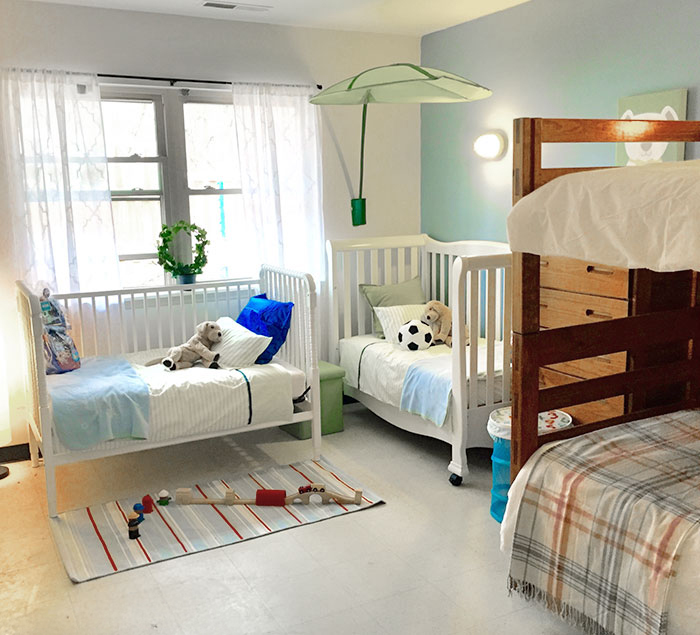 Redesigned shelter room with a bunk bed and two smaller beds.