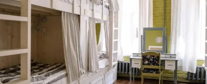 Best furniture for shelter rooms, including clean bunk beds in a cozy dorm
